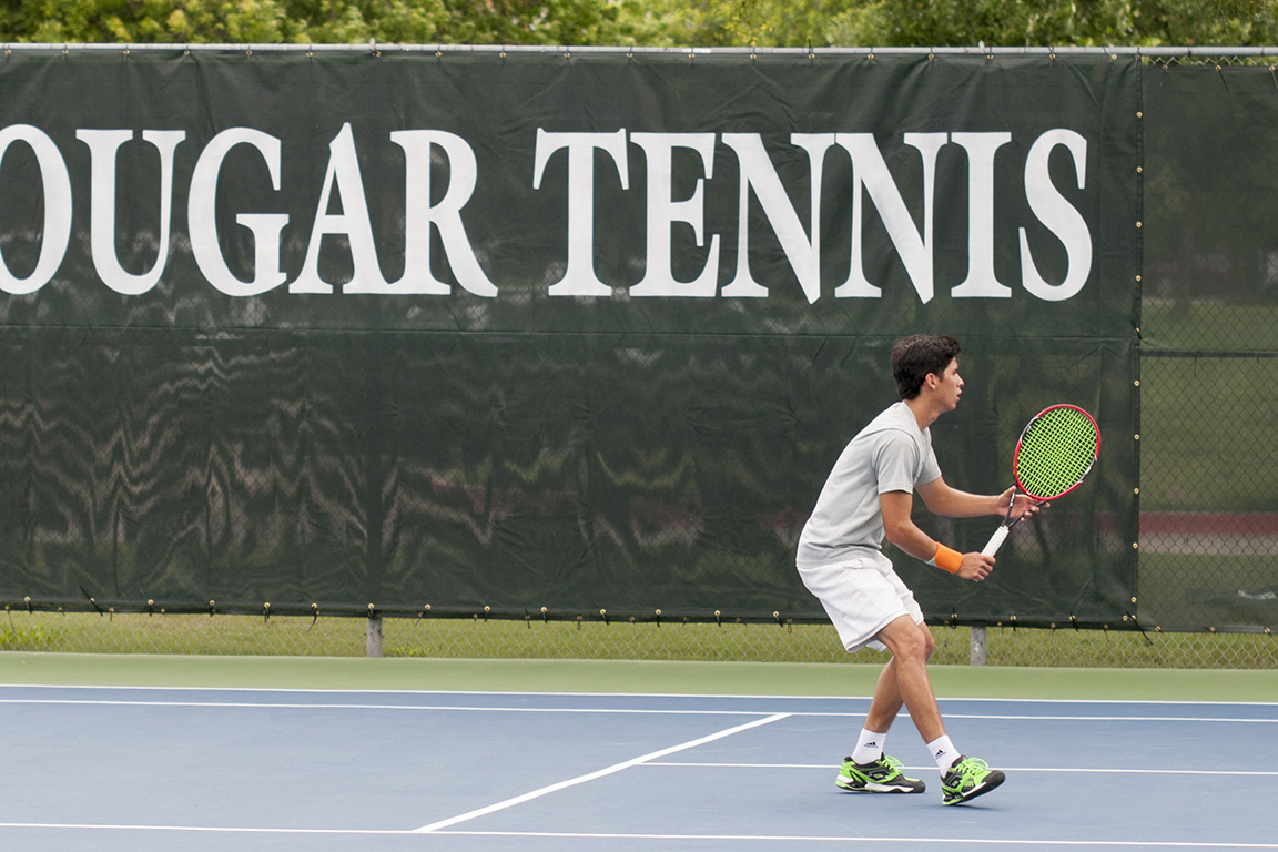 A tennis player sets up for a shot on Collin College's tennis courts.