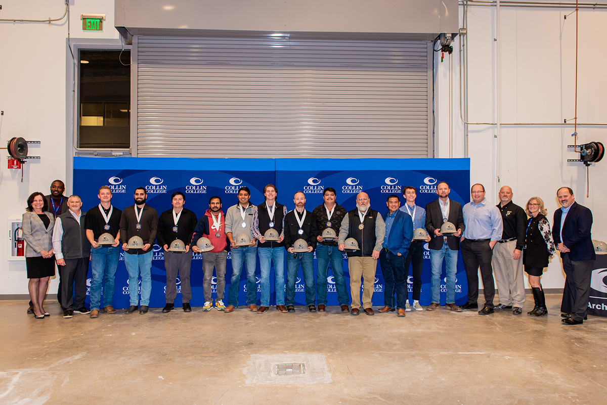 Twelve Collin College students representing the first graduating class in the Bachelor of Science in Construction Management program received their hardhats and a medal.