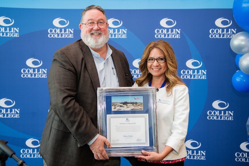 Collin College President Dr. Neil Matkin presents a certificate of recognition to Dr. Diana Hopes for her work at the Farmersville Campus.